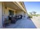 Spacious covered patio with comfortable seating, a grill, and views of the lush green yard at 2663 S Springwood Blvd # 326, Mesa, AZ 85209