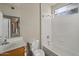 Bathroom with tub and shower combination features tile and a window at 2992 N Miller Rd # 103, Scottsdale, AZ 85251