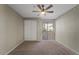 Inviting bedroom with a closet and a sliding glass door to the outdoor patio at 2992 N Miller Rd # 103, Scottsdale, AZ 85251