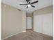 Neutral bedroom features carpet, ceiling fan and closet with sliding doors at 2992 N Miller Rd # 103, Scottsdale, AZ 85251