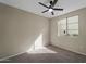 Bright bedroom with plenty of natural light, cozy carpeting, and ceiling fan at 2992 N Miller Rd # 103, Scottsdale, AZ 85251