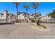 Charming gated community entrance featuring beautiful landscaping and well-maintained facades at 2992 N Miller Rd # 103, Scottsdale, AZ 85251
