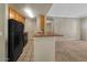 Functional kitchen space with a breakfast bar connecting to the living area, ideal for entertaining at 2992 N Miller Rd # 103, Scottsdale, AZ 85251