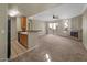 Inviting living room featuring a fireplace, with a kitchen bar, and a sliding door to a patio at 2992 N Miller Rd # 103, Scottsdale, AZ 85251