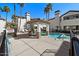 Community pool with lounge chairs and covered seating area, No Diving! at 2992 N Miller Rd # 103, Scottsdale, AZ 85251