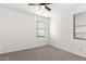 Bedroom with neutral walls, carpet, and a ceiling fan at 29991 W Mitchell Ave, Buckeye, AZ 85396