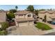 Beautiful two-story home with a three-car garage, tile roof, and green lawn, offering ample parking and a welcoming entrance at 314 W Loma Vista St, Gilbert, AZ 85233