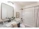 A cozy bathroom with a modern sink and a shower-tub combination at 3624 W Whitten St, Chandler, AZ 85226