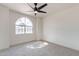 Light-filled bedroom with a vaulted window and neutral carpet at 3624 W Whitten St, Chandler, AZ 85226
