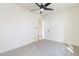 A bedroom featuring white walls, carpet and a ceiling fan at 3624 W Whitten St, Chandler, AZ 85226
