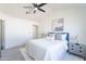 A bedroom featuring white walls, a ceiling fan and carpet at 3624 W Whitten St, Chandler, AZ 85226