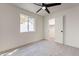 A bright, airy bedroom with a ceiling fan, and an open closet at 3624 W Whitten St, Chandler, AZ 85226