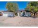 Inviting exterior showcasing arched windows, a neatly kept yard, and an attached two-car garage at 3624 W Whitten St, Chandler, AZ 85226