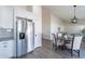 Bright kitchen featuring stainless steel appliances, white cabinets, subway tile backsplash, and wood-look floors at 3624 W Whitten St, Chandler, AZ 85226