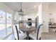 Bright kitchen with stainless steel appliances, white cabinets, eat-in dining area and a sliding glass door to the backyard at 3624 W Whitten St, Chandler, AZ 85226