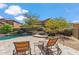 Backyard with a patio, pool with stone accents, and mature landscaping at 3713 E Cat Balue Dr, Phoenix, AZ 85050