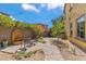 Serene backyard oasis with a water feature, a cozy seating area, and lush greenery at 3713 E Cat Balue Dr, Phoenix, AZ 85050