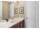 Bathroom vanity with a sink, a mirror, and wall decor at 3713 E Cat Balue Dr, Phoenix, AZ 85050