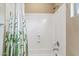 Bathroom shower and tub combo with green patterned shower curtain at 3713 E Cat Balue Dr, Phoenix, AZ 85050