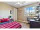 Bright bedroom with a large window, a desk, and comfortable decor at 3713 E Cat Balue Dr, Phoenix, AZ 85050