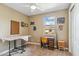 Bedroom with a ceiling fan, carpet flooring, natural light, and desk with chair at 3713 E Cat Balue Dr, Phoenix, AZ 85050