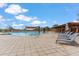 Stunning community pool area featuring lounge chairs, sunshades, and meticulously tiled decks at 3713 E Cat Balue Dr, Phoenix, AZ 85050