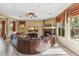 Comfortable living room with fireplace, large windows, and a spacious seating area at 3713 E Cat Balue Dr, Phoenix, AZ 85050