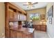 Home office with custom built-in wooden desk, cabinetry, and a window view at 3713 E Cat Balue Dr, Phoenix, AZ 85050