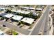 Overhead view of a neighborhood featuring homes with white roofs, desert landscaping and a wide street at 4001 E Cannon Dr, Phoenix, AZ 85028