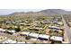 Expansive aerial view of a residential neighborhood surrounded by desert landscape and mountains in the background at 4001 E Cannon Dr, Phoenix, AZ 85028