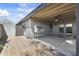 Inviting back patio with an outdoor grill and covered area, perfect for entertaining and enjoying outdoor meals at 4001 E Cannon Dr, Phoenix, AZ 85028