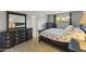 Cozy bedroom featuring elegant furniture, a comfortable bed, and natural light filtering through the window at 4001 E Cannon Dr, Phoenix, AZ 85028
