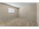 Comfortable bedroom with soft carpet, natural light, and window blinds at 4001 E Cannon Dr, Phoenix, AZ 85028