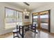Inviting dining area with an industrial wooden table and a view of the backyard at 4001 E Cannon Dr, Phoenix, AZ 85028