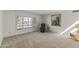Living room features a cozy chair and large window at 4001 E Cannon Dr, Phoenix, AZ 85028