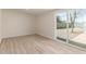 Bedroom featuring wood-look floors and a sliding glass door at 4214 N 48Th Ave, Phoenix, AZ 85031