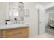Bright bathroom with modern fixtures, a wooden vanity, and a stylish framed mirror at 4216 N 42Nd St, Phoenix, AZ 85018