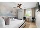 Serene bedroom with a decorative mural, ceiling fan, and ample natural light at 4216 N 42Nd St, Phoenix, AZ 85018