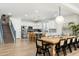 Open-concept kitchen with stainless steel appliances, white cabinetry, and adjacent dining area at 4216 N 42Nd St, Phoenix, AZ 85018