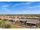 Wide aerial view showcasing the neighborhood, surrounding landscape, and the property's location at 42186 W Cribbage Rd, Maricopa, AZ 85138