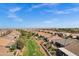 Wide aerial view showcasing the neighborhood, surrounding landscape, and the property's location at 42186 W Cribbage Rd, Maricopa, AZ 85138