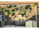 Aerial view of the property showcasing the landscaped backyard with fireplace and patio area at 42186 W Cribbage Rd, Maricopa, AZ 85138
