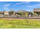 Charming single-story home with a well-manicured lawn and a classic white picket fence at 42186 W Cribbage Rd, Maricopa, AZ 85138
