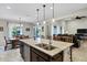 Open concept kitchen with granite countertop island and double sink at 42186 W Cribbage Rd, Maricopa, AZ 85138