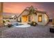 Backyard featuring a pool, desert landscaping, and a covered patio perfect for entertaining at 43298 W Delia Blvd, Maricopa, AZ 85138