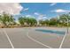 Outdoor basketball court in the Villages at Rancho El Dorado community featuring multiple hoops and well-maintained surface at 43298 W Delia Blvd, Maricopa, AZ 85138