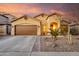 Charming single-Gathering home with a well-manicured front yard and two-car garage on a beautiful day at 43298 W Delia Blvd, Maricopa, AZ 85138