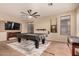 The large game room includes a pool table with a TV mounted on the wall at 43298 W Delia Blvd, Maricopa, AZ 85138
