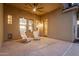 Covered patio with two chairs offers outdoor seating and relaxation at 43298 W Delia Blvd, Maricopa, AZ 85138