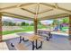 Covered picnic area with benches is conveniently located near the community playground at 43298 W Delia Blvd, Maricopa, AZ 85138